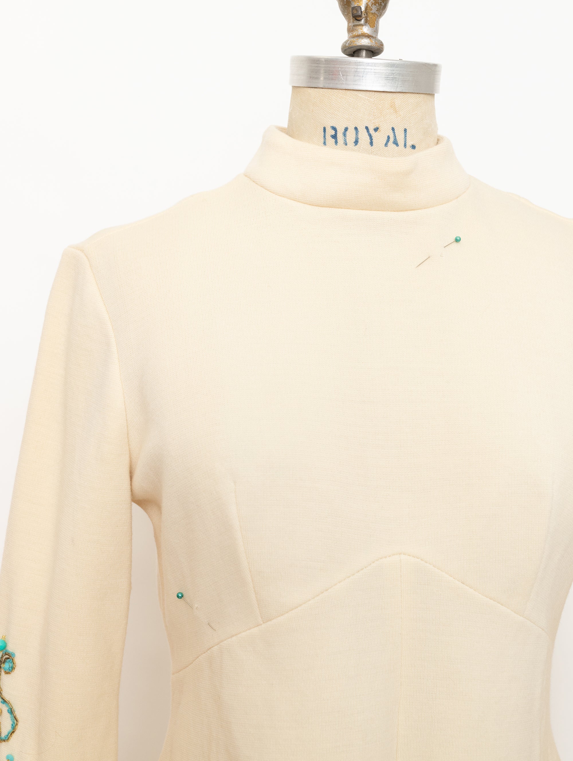 1960s cream mock neck long sleeve top with turquoise beads