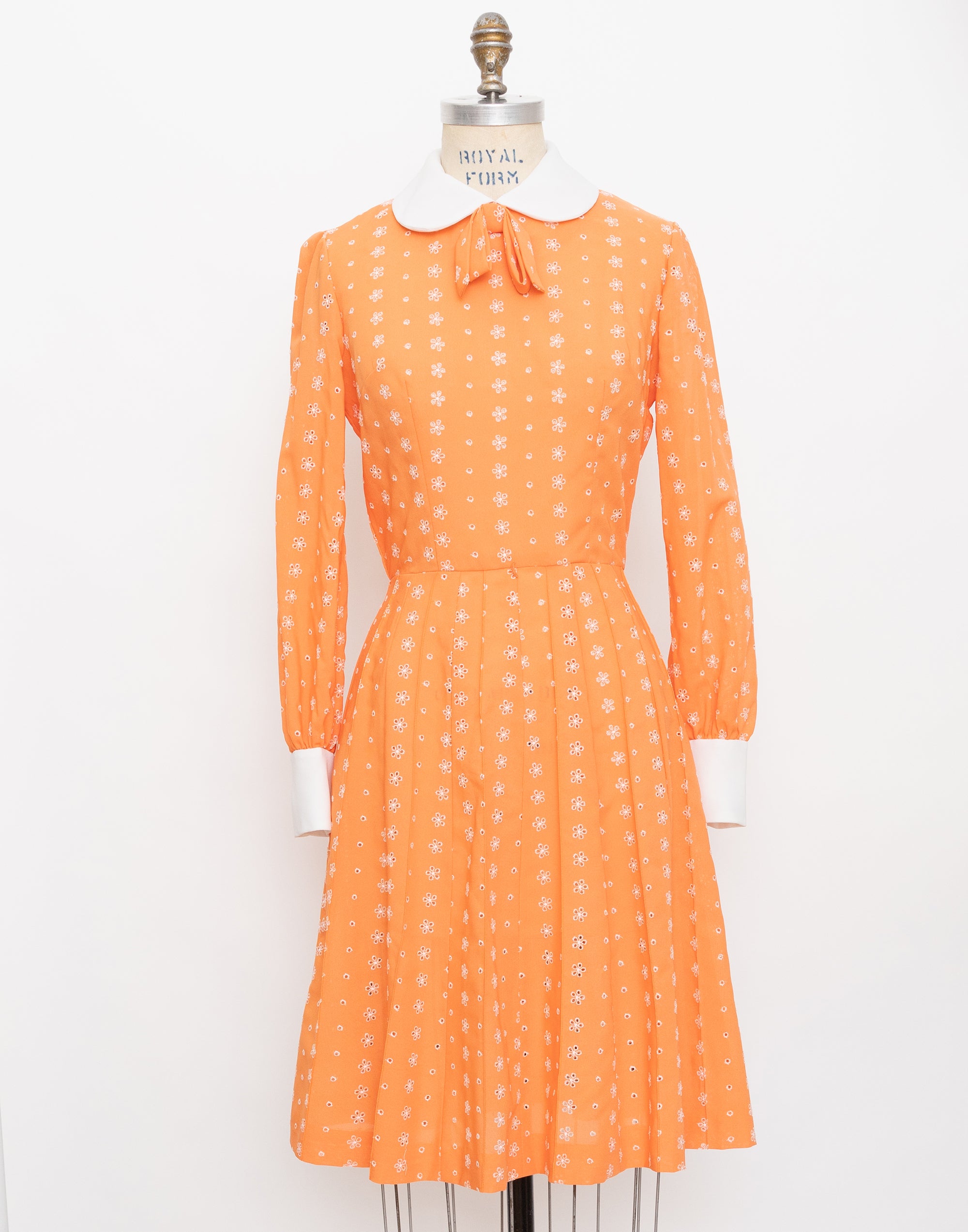 60s Herman Marcus orange eyelet long sleeve dress with white peter pan collar + cuffs 1