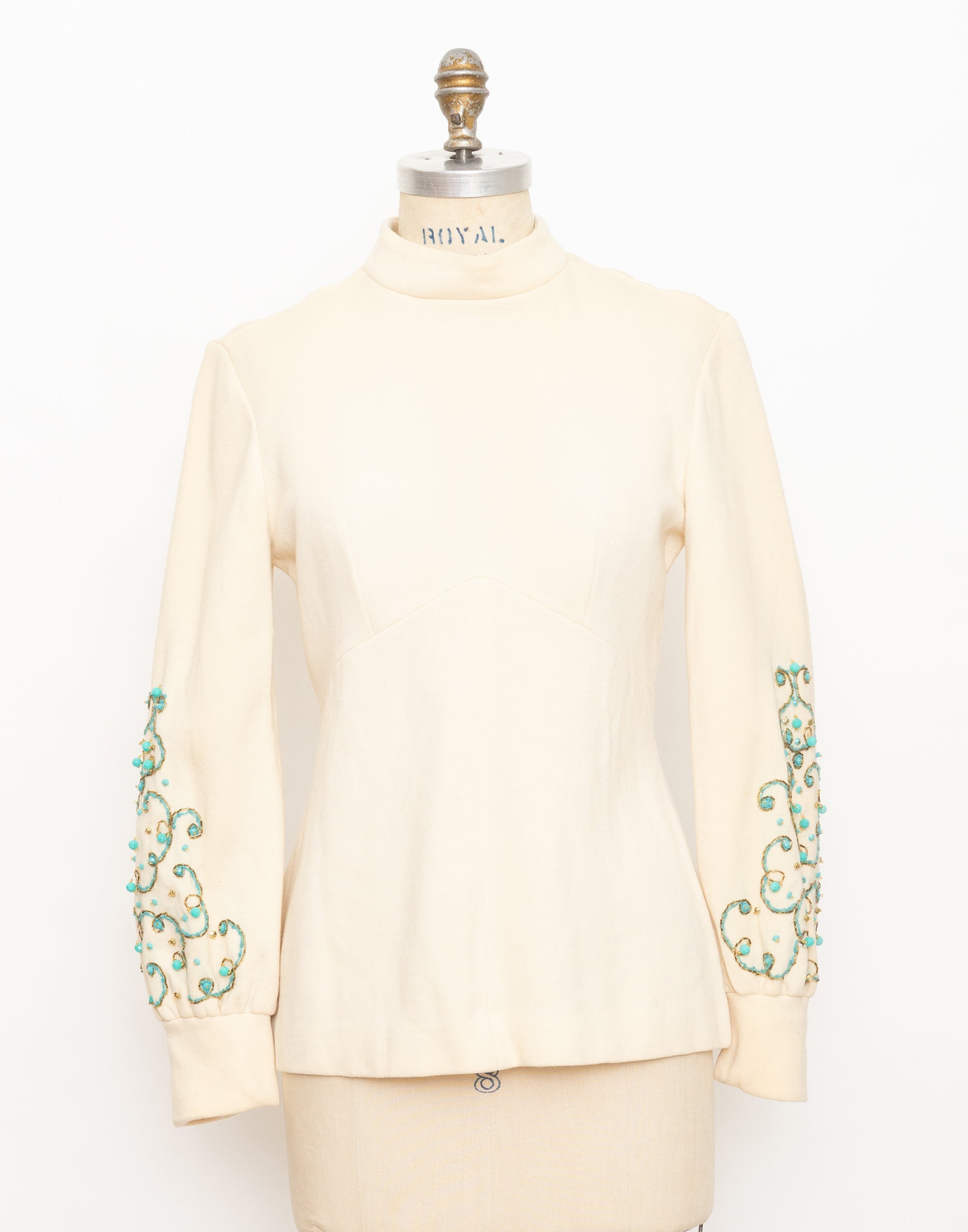 1960s cream mock neck long sleeve top with turquoise beads