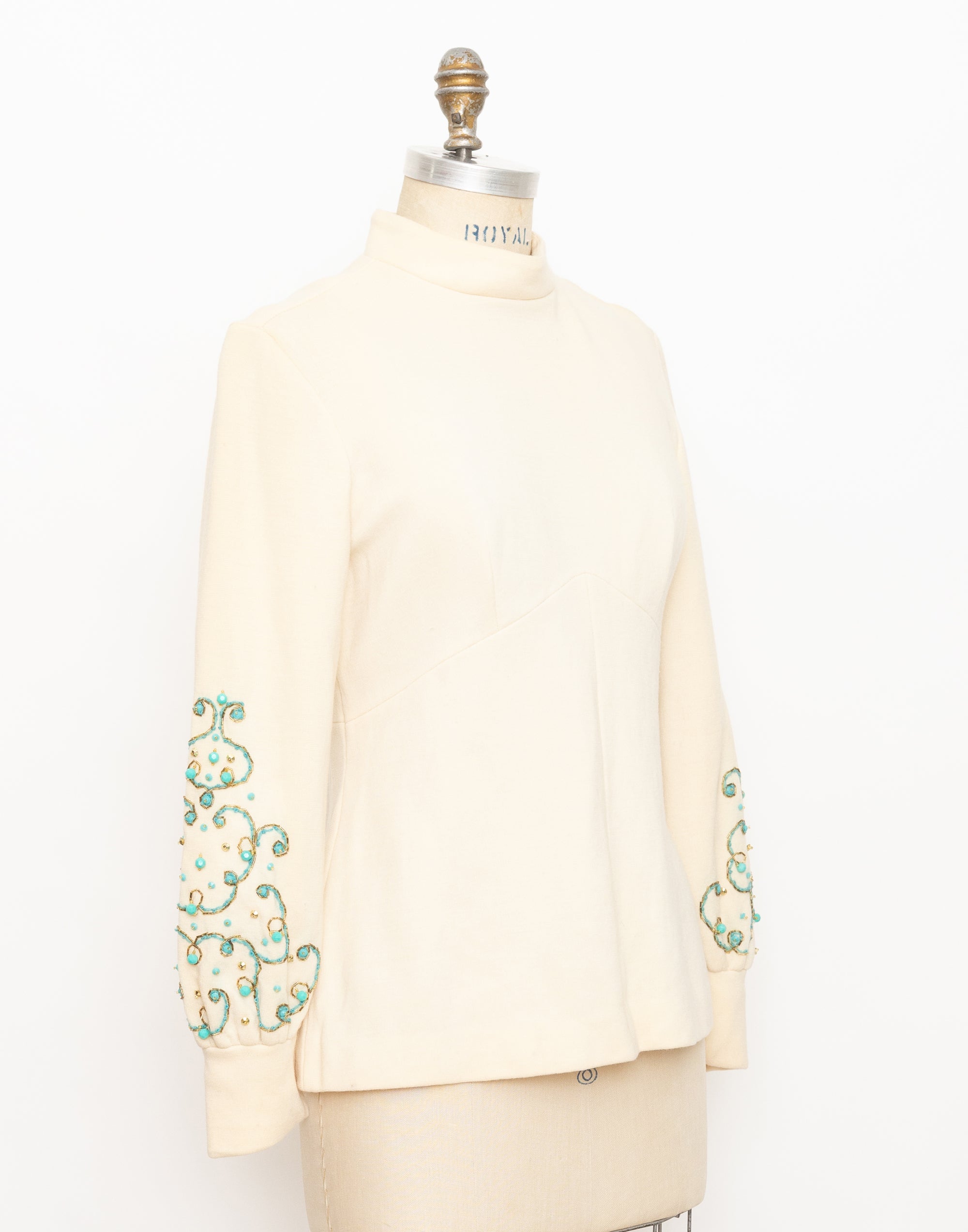 1960s cream mock neck long sleeve top with turquoise beads